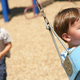 Image for article titled Older Brother Playing With Younger Brother On Swing Set Will One Day Con Him Out Of $50,000